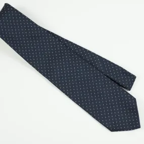 Loosely woven navy silk tie, small white dots